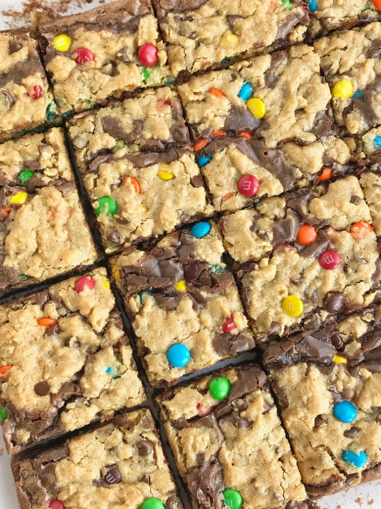 Monster Cookie Brownies | Monster Cookies | Brownies | Brookies | Monster cookie brownies start with a boxed brownie mix and then topped with a homemade monster cookie dough. Two desserts in one! Milk chocolate brownies and monster cookies loaded with peanut butter, oats, chocolate chips, and m&m's. #dessert #easydessertrecipes #brownies