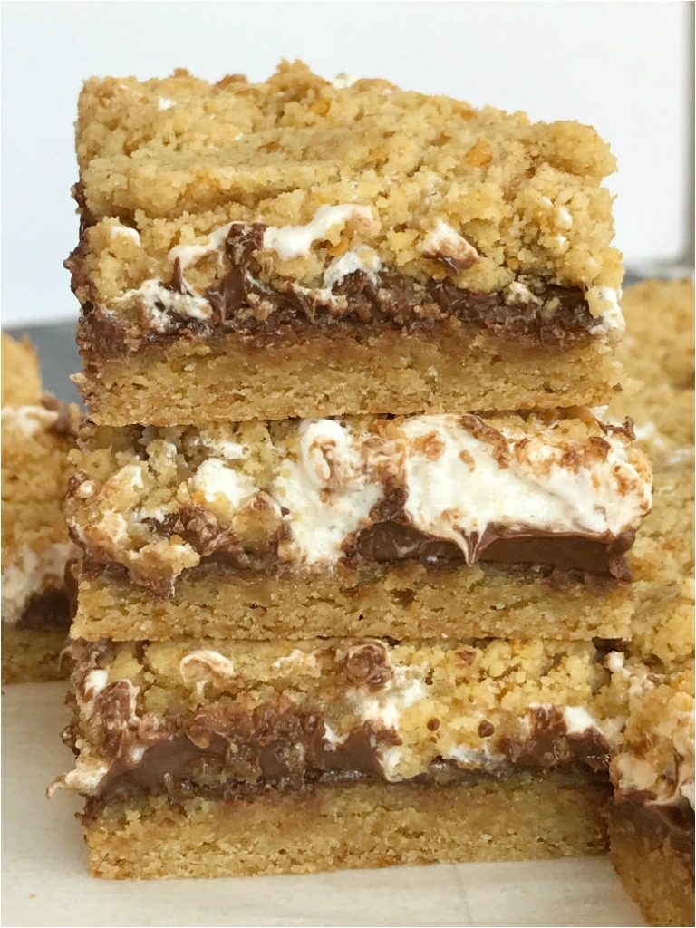 S'mores Cookie Bars | S'mores Recipe | Cookie Bars | S'mores | Get ready for summer with these delicious S'mores Cookie Bars. Graham cracker cookie dough is layered with marshmallow cream and Hershey milk chocolate bars for a dessert that is reminiscent of everyone's campfire favorite treat. #dessertrecipes #easydessertrecipes #smores #chocolate