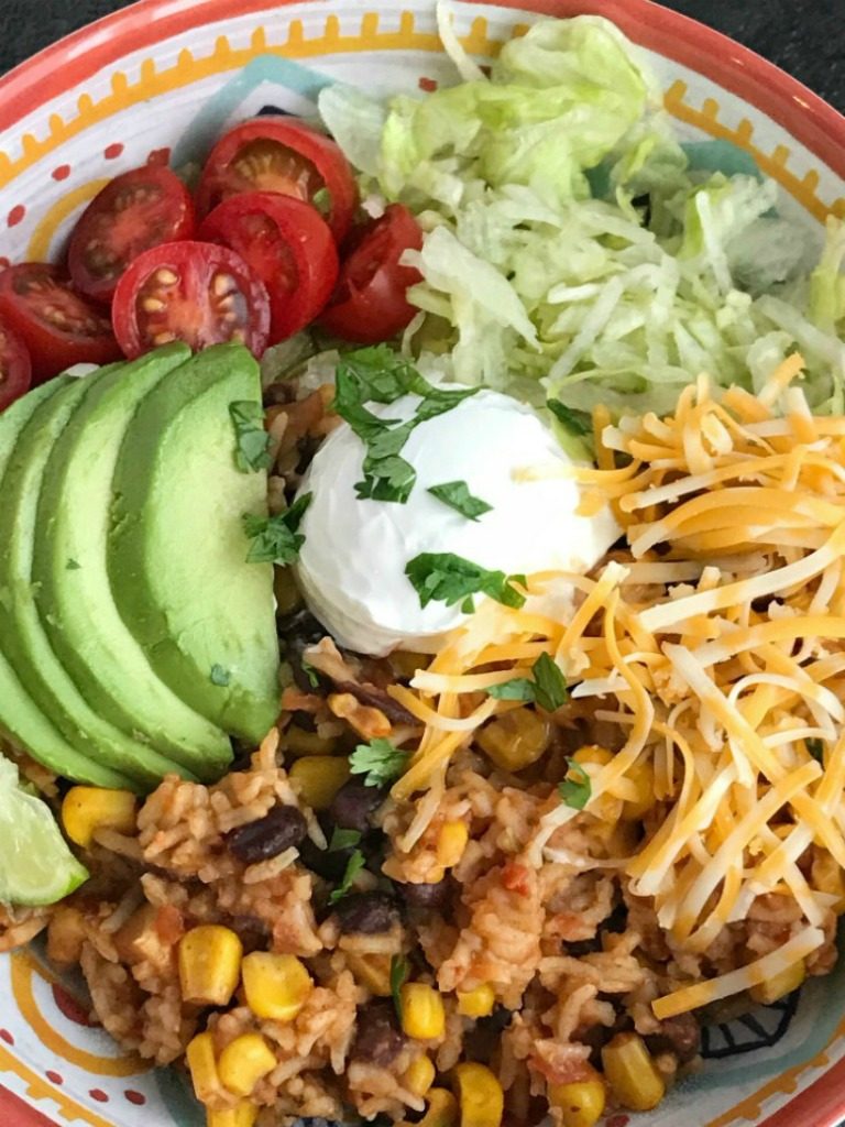 Instant Pot Chicken Burrito Bowls | Instant Pot Recipe | Chicken Recipes | Instant Pot Chicken Recipes | Burrito Bowls | Instant Pot chicken burrito bowls can be on the dinner table in 30 minutes! All your favorite things about a burrito but made into a delicious burrito bowl. Top with lettuce, cheese, tomato, avocado for a quick & easy family approved dinner. If you're looking for the best Instant Pot chicken recipe then this is it! #instantpotrecipe #instantpot #chicken #dinner #easydinner