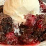 Black Forest Chocolate Cobbler | Chocolate Cobbler | Black Forest Dessert | Desser Recipes | Chocolate cobbler gets a fun black forest twist with canned cherry pie filling. You only need 4 ingredients to make this easy black forest chocolate cobbler dessert. Serve with some whipped cream or a scoop of ice cream for an easy & simple dessert recipe that everyone will love. #dessert #chocolate #easydessertrecipes