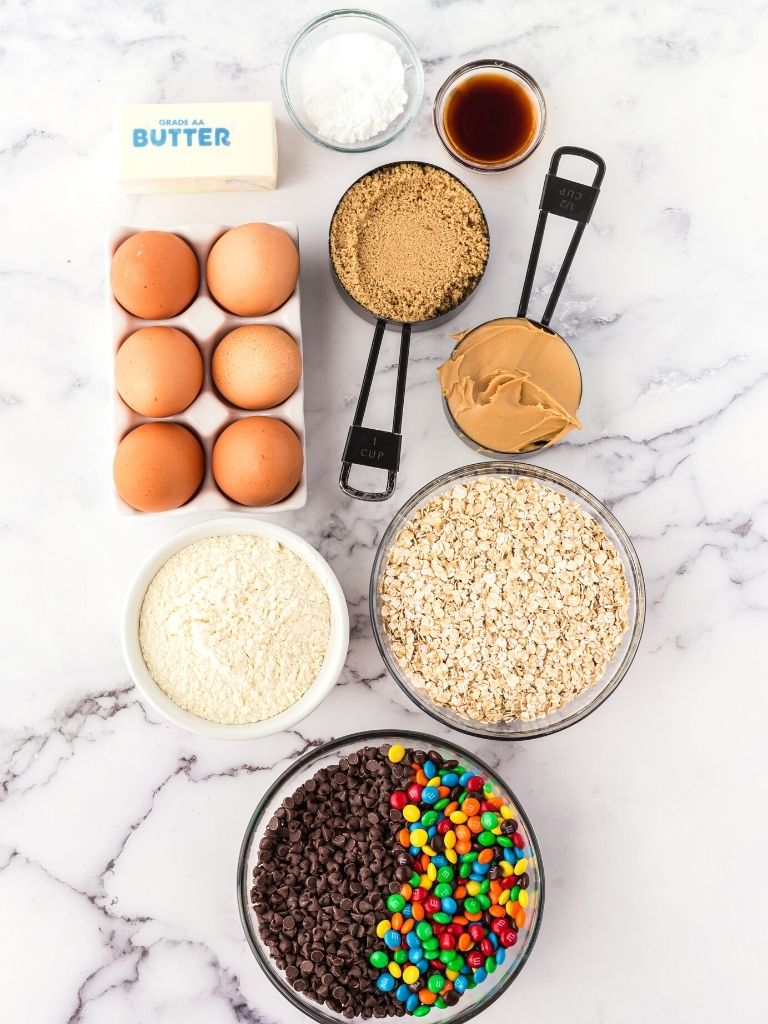 Ingredients needed to make monster cookies with the ingredients shown in an overhead shot. 