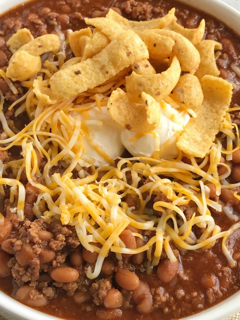 Baked Bean & Beef Chili | Chili Recipe | Baked bean beef chili is an easy, 4 ingredient chili recipe that is sweet & spicy! Sweet baked beans, lean ground beef, tomato juice, and seasonings make this chili so quick and easy to make. Don't forget the corn chips, shredded cheese, and sour cream! #chilirecipes #dinnerrecipes #chili #groundbeef #recipes