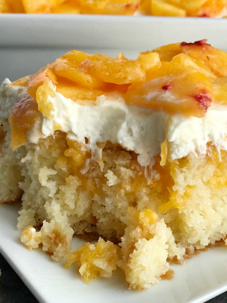 https://togetherasfamily.com/wp-content/uploads/2018/08/peaches-and-cream-poke-cake-4.jpg