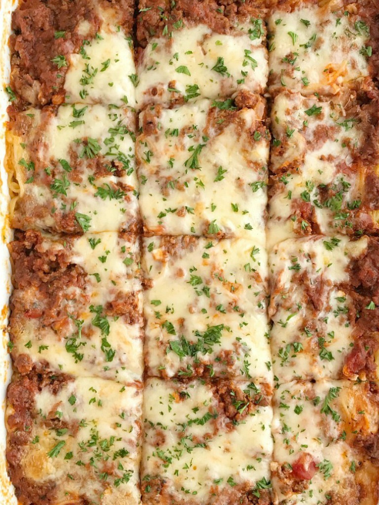 Baked Spaghetti Casserole is a family favorite dinner that's filled with pasta, cheese, and an easy semi-homemade ground beef meat sauce. This gets gobbled up even by the pickiest eaters when I make it for dinner. Serve with a salad and garlic bread for a delicious and heart family dinner. 