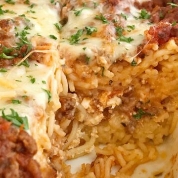 Baked Spaghetti Casserole is a family favorite dinner that's filled with pasta, cheese, and an easy semi-homemade ground beef meat sauce. This gets gobbled up even by the pickiest eaters when I make it for dinner. Serve with a salad and garlic bread for a delicious and heart family dinner. 