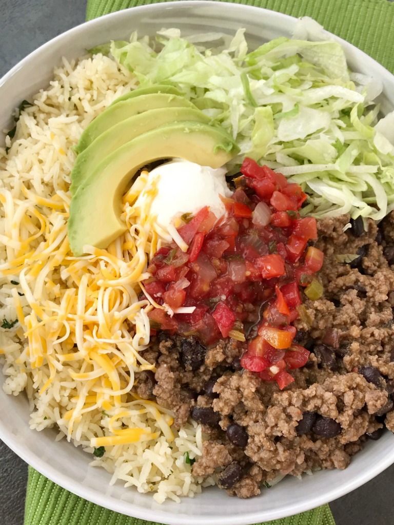 Beef Taco Burrito Bowls | Mexican Food | Dinner Recipe | Burrito Bowls | Beef taco burrito bowls are so easy to make at home! Seasoned beef taco meat with black beans, layered with rice, and all the taco toppings you want. Everyone can make their own for a fun, quick & easy, and delicious dinner. #dinnerrecipes #recipeoftheday #mexicanfood #burritobowls #groundbeef