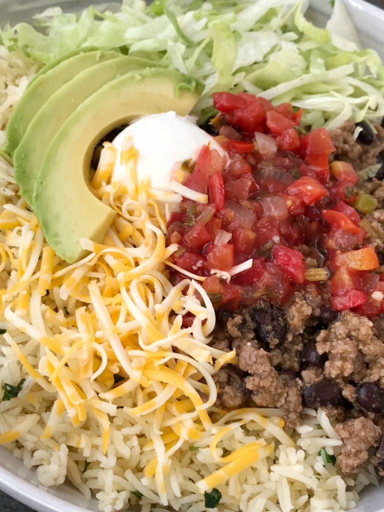 Beef Taco Burrito Bowls | Mexican Food | Dinner Recipe | Burrito Bowls | Beef taco burrito bowls are so easy to make at home! Seasoned beef taco meat with black beans, layered with rice, and all the taco toppings you want. Everyone can make their own for a fun, quick & easy, and delicious dinner. #dinnerrecipes #recipeoftheday #mexicanfood #burritobowls #groundbeef