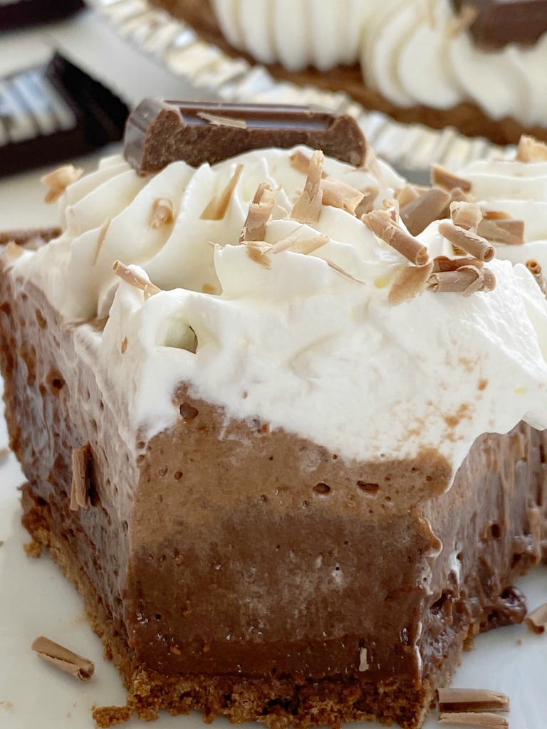 Chocolate Cream Pie is an easy no bake pie with three layers of creamy chocolate pudding & freshly whipped cream inside a chocolate cookie crust. Only 4 ingredients needed! Don't forget to garnish with chocolate curls and chocolate bar pieces!