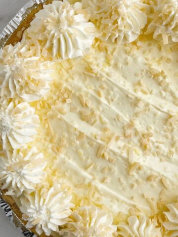 Coconut cream pie recipe with instant pudding mix and cream cheese and toasted coconut on top.