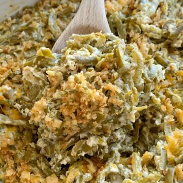 Green bean casserole recipe. Canned green beans, cheese, french fried onions, and a few seasonings is all you need for the best green bean casserole. This green bean casserole has no mushrooms and no creamed soups in it!