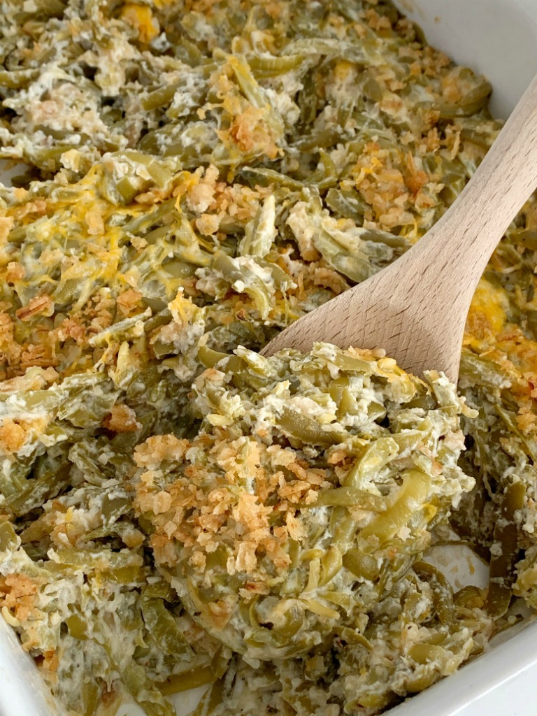 Green bean casserole recipe. Canned green beans, cheese, french fried onions, and a few seasonings is all you need for the best green bean casserole. This green bean casserole has no mushrooms and no creamed soups in it!