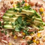 Creamy Southwest Chicken Chili | Slow Cooker | Crock Pot Chili | Chili Recipe | White Chicken Chili | Creamy chicken chili with southwest flavors that cooks right in the crock pot. Chicken breast, corn, pinto beans, ranch seasoning & spices combine in the slow cooker for an easy, simple family dinner. Serve with shredded cheese, avocado slices, and cilantro. #chili #chilirecipes #dinnerrecipe #chicken #slowcookerrecipes