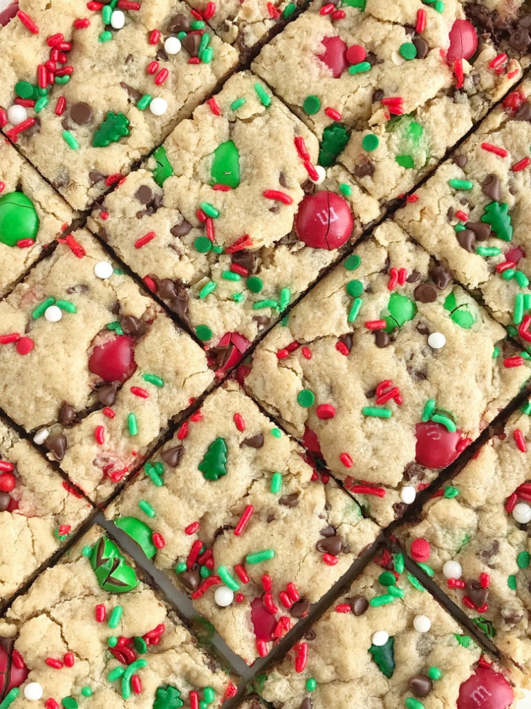 Santa's Cookies | Peanut Butter Oatmeal Cookie Bars | Christmas Recipe | Santa's cookie bars are perfect for Christmas Eve on the cookie plate! A soft, thick, and chewy peanut butter cookie bar loaded with oats, chocolate, peanut butter m&m's, and festive red and green sprinkles. #christmasrecipe #peanutbutterrecipes #dessert #dessertrecipe #recipeoftheday #holidayrecipe