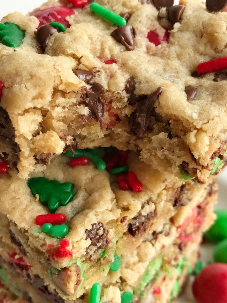 Santa's Cookies | Peanut Butter Oatmeal Cookie Bars | Christmas Recipe | Santa's cookie bars are perfect for Christmas Eve on the cookie plate! A soft, thick, and chewy peanut butter cookie bar loaded with oats, chocolate, peanut butter m&m's, and festive red and green sprinkles. #christmasrecipe #peanutbutterrecipes #dessert #dessertrecipe #recipeoftheday #holidayrecipe