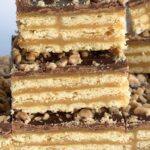 Triple Layer Cracker Toffee Bars | Toffee Recipe | Caramel Recipe | Cracker Toffee | These easy caramel & chocolate triple layer cracker toffee bars are a fun twist to traditional cracker toffee. One pan, three layers, and only about 10 minutes is all you need for sweet, buttery, salty perfection. It's a must make Christmas recipe! #holidayrecipe #christmasrecipe #dessert #easydessertrecipes #caramel #toffee #recipeoftheday