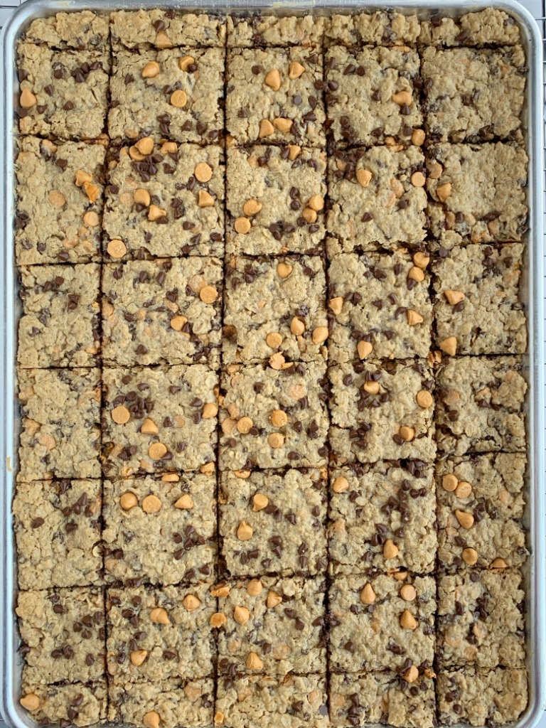 Chewy butterscotch peanut butter cookie bars have no flour! Hearty, chewy, soft baked, and loaded with chocolate and butterscotch chips. This cookie bar recipe makes lots of cookie bars so it's perfect for snacks (freeze extras) or big gatherings. 