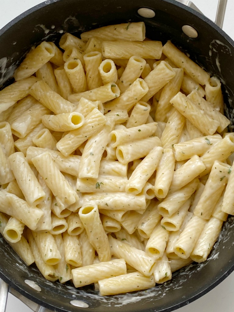 Easy Garlic Parmesan Pasta is a family favorite 20 minute dinner recipe! This is my family's most loved & requested recipe. Pasta noodles covered in a creamy garlic parmesan white sauce.