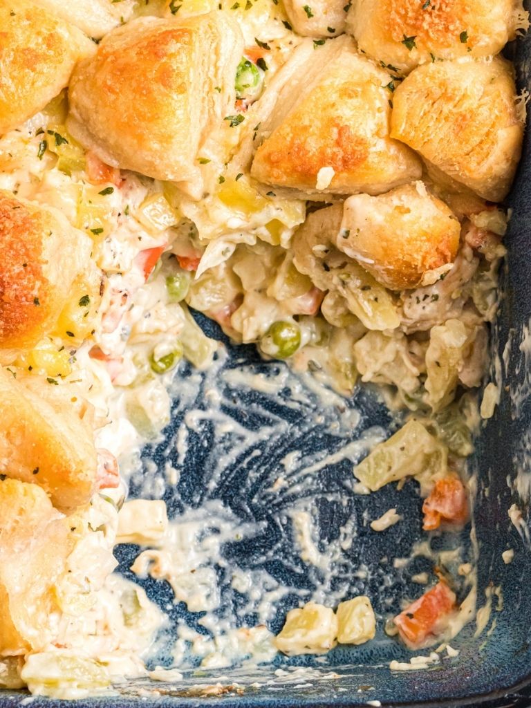 A casserole dish with chicken pot pie inside of it.