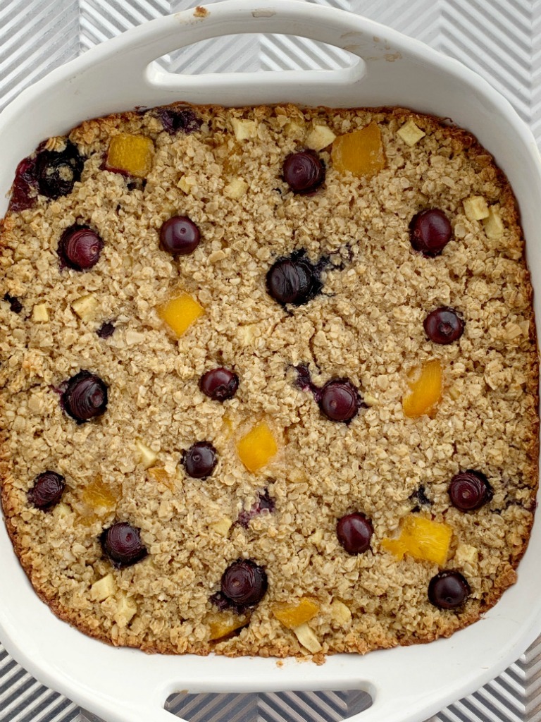 Fruity Baked Oatmeal | Baked Oatmeal | Breakfast Recipe | Baked oatmeal with quick oats, fresh blueberries, peaches, and diced apple. Sweetened with brown sugar and contains 3 entire cups of oatmeal. Warm, comforting and can be eaten for breakfast or a snack. #breakfast #breakfastrecipe #recipeoftheday #oatmeal #bakedoatmeal