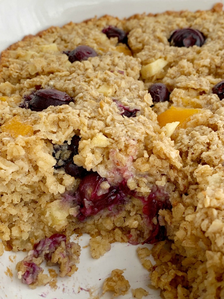 Fruity Baked Oatmeal | Baked Oatmeal | Breakfast Recipe | Baked oatmeal with quick oats, fresh blueberries, peaches, and diced apple. Sweetened with brown sugar and contains 3 entire cups of oatmeal. Warm, comforting and can be eaten for breakfast or a snack. #breakfast #breakfastrecipe #recipeoftheday #oatmeal #bakedoatmeal