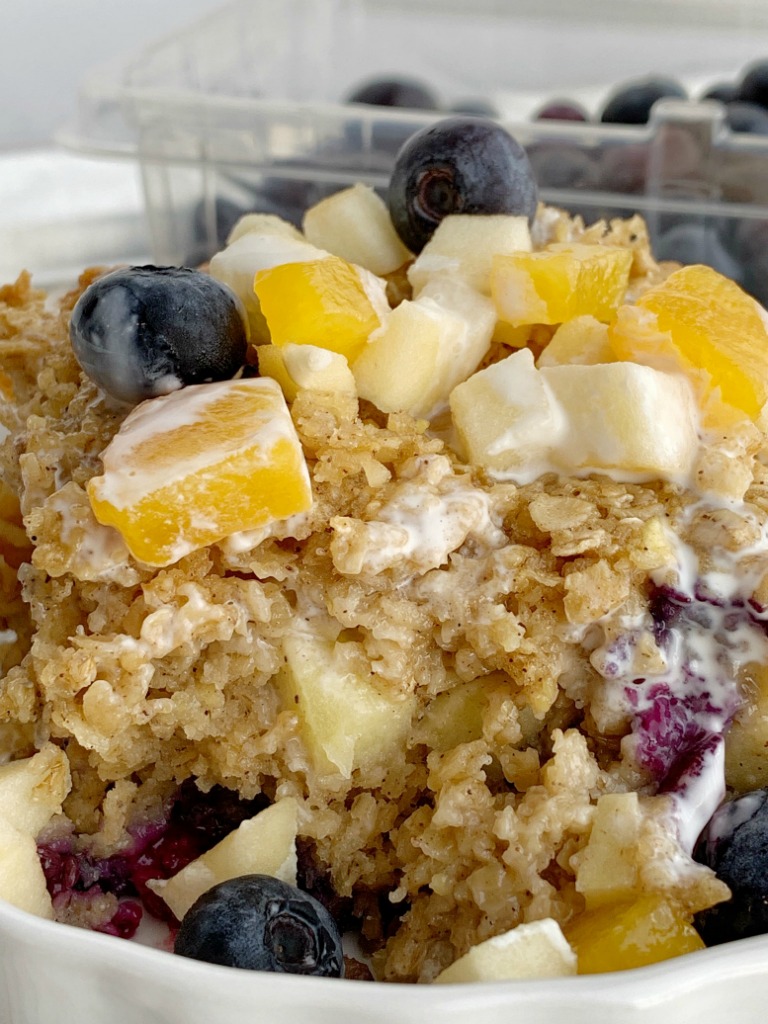 Fruity Baked Oatmeal | Baked Oatmeal | Breakfast Recipe | Baked oatmeal with quick oats, fresh blueberries, peaches, and diced apple. Sweetened with brown sugar and contains 3 entire cups of oatmeal. Warm, comforting and can be eaten for breakfast or a snack. #breakfast #breakfastrecipe #recipeoftheday #oatmeal #bakedoatmeal