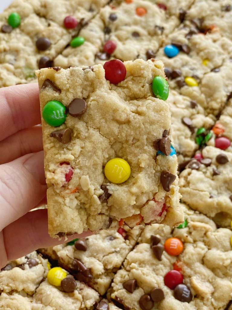 Monster cookie bars are a fun treat loaded with peanut butter, oats, chocolate chips, peanut butter chips, and mini m&m's. They bake up perfectly soft, chewy, and thick. A fun treat to make with the kids or great for back-to-school lunches or after school treat. 