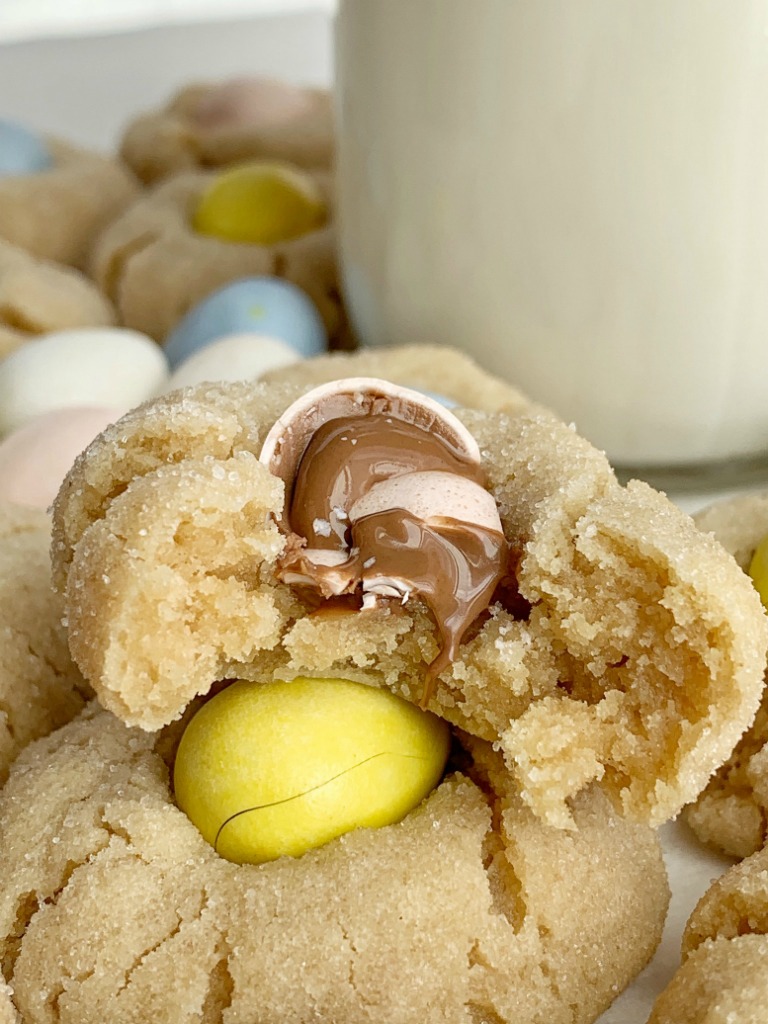 Cadbury Egg Kiss Cookies | Kiss Cookies | Cadbury Mini Eggs | Easter Recipe | Cadbury Egg Kiss Cookies are a fun way to celebrate spring and Easter! Soft, thick peanut butter cookies rolled in sugar and topped with a Cadbury Mini Egg. #easter #easterrecipes #cadburyminieggs #kisscookies #cookies #peanutbutter #dessert #recipeoftheday