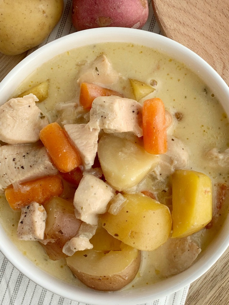 Crock Pot Creamy Chicken Stew | Chicken Stew | Stew Recipes | Slow Cooker Recipes | Chicken Stew made right in the slow cooker! So simple to make, creamy, delicious, comfort food, that the entire family will devour. Carrots, potatoes, and chunked chicken is cooked in a creamy sauce with ranch seasoning, chicken broth, cream of chicken soup, and sour cream in the crock pot. #stewrecipe #recipeoftheday #dinnerideas #slowcooker #crockpot #chickenrecipes