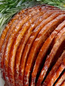 Slow Cooker Honey Glazed Ham | Ham Recipe | Boneless Ham | Crock Pot Ham Recipe | Honey glazed ham made in the slow cooker! Boneless, spiral sliced ham cooks in an easy 4 ingredients honey glaze. So flavorful and even easier to make this ham recipe. #ham #hamrecipe #easterrecipes #slowcooker #crockpotrecipes #honeyham