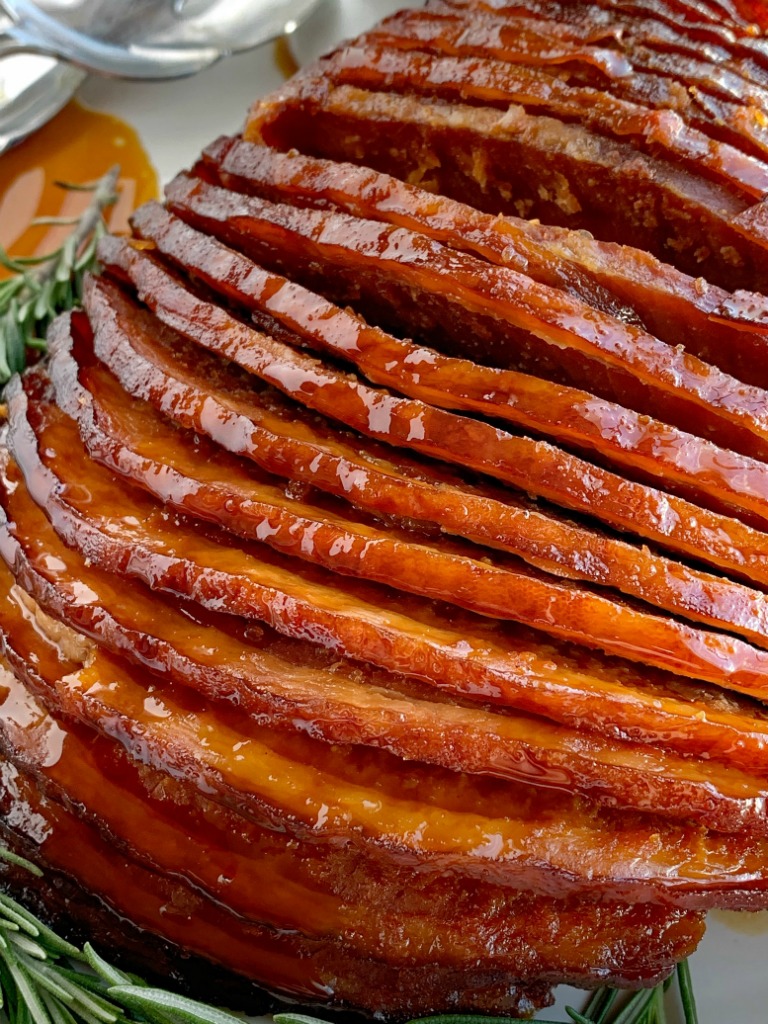 Slow Cooker Honey Glazed Ham | Ham Recipe | Boneless Ham | Crock Pot Ham Recipe | Honey glazed ham made in the slow cooker! Boneless, spiral sliced ham cooks in an easy 4 ingredients honey glaze. So flavorful and even easier to make this ham recipe. #ham #hamrecipe #easterrecipes #slowcooker #crockpotrecipes #honeyham