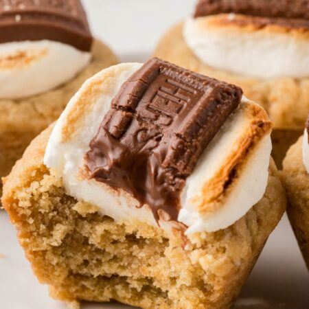 A s'more cookie cup on a white plate.