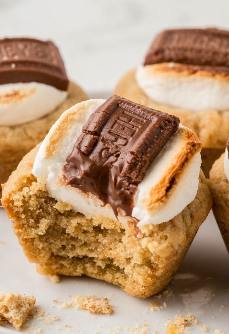 A s'more cookie cup on a white plate.