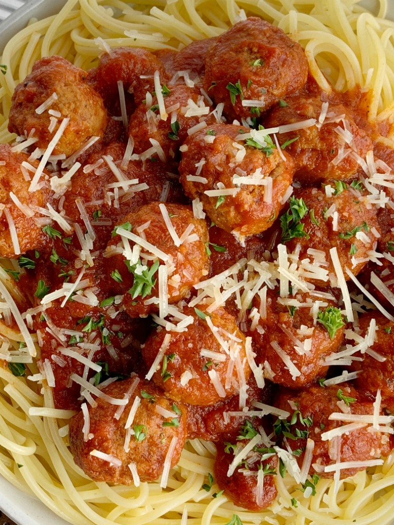 Easy Slow Cooker Spaghetti & Meatballs | Spaghetti Meatballs Recipe | Dinner Recipes | Classic spaghetti meatballs that happen to be so easy to make right in a slow cooker! Frozen meatballs, pasta sauce, stewed tomatoes, and spices simmer all day for an at home restaurant taste. #spaghetti #dinner #meatballs #italianfood #recipeoftheday #dinnerrecipes #easydinnerrecipes