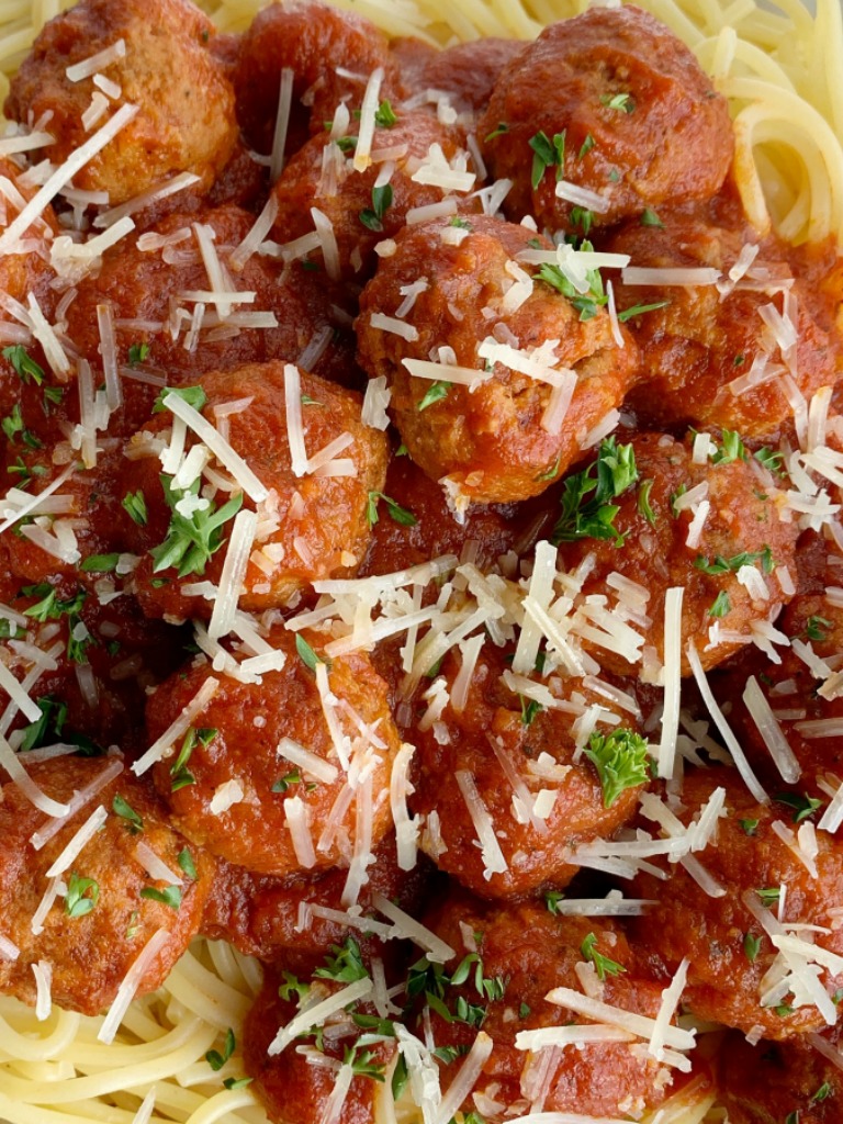 Easy Slow Cooker Spaghetti & Meatballs | Spaghetti Meatballs Recipe | Dinner Recipes | Classic spaghetti meatballs that happen to be so easy to make right in a slow cooker! Frozen meatballs, pasta sauce, stewed tomatoes, and spices simmer all day for an at home restaurant taste. #spaghetti #dinner #meatballs #italianfood #recipeoftheday #dinnerrecipes #easydinnerrecipes