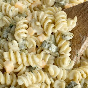 Close up shot of dill pickle pasta salad with creamy homemade dill dressing
