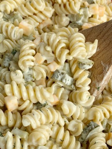 Close up shot of dill pickle pasta salad with creamy homemade dill dressing