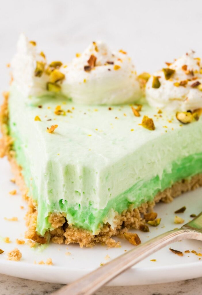 A slice of pie with a fork bite taken out of the front to show the pie layers.