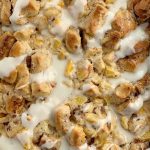 Peaches n' Cream Cinnamon Roll Casserole | Cinnamon Roll Casserole | Breakfast Recipes | Cinnamon Roll Casserole with peaches n' cream. Frozen peaches, cream cheese, powdered sugar, and cinnamon rolls combine to create the best sweet breakfast treat. Only 4 ingredients needed! #breakfastrecipes #casserole #cinnamonrolls #peaches #breakfastcasserole #recipeoftheday