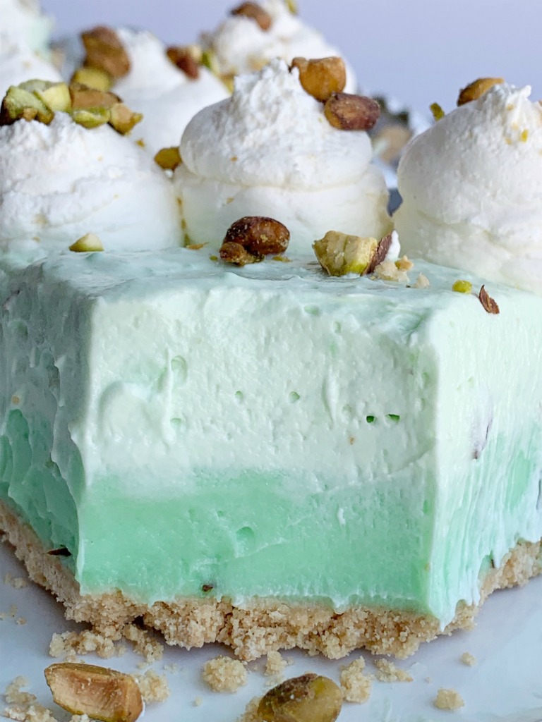 No Bake Pistachio Cheesecake Pie | Pistachio Cheesecake | No Bake Pie Recipe | No Bake Desserts | Pistachio Cheesecake Pie is no bake and so simple to make! Graham cracker crust with three layers of creamy, fluffy pistachio pudding filling. #nobakerecipes #nobake #nobakedesserts #pie #pistachio #easydessertrecipes #recipeoftheday #summerrecipes #holidayrecipes