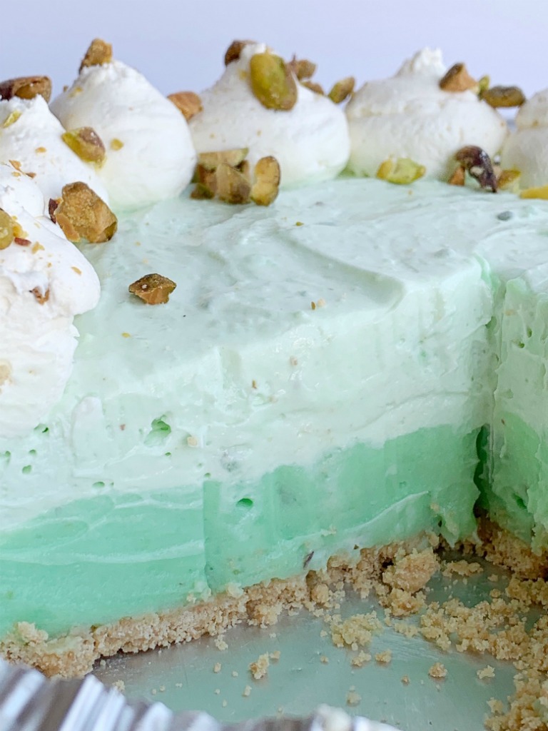 No Bake Pistachio Cheesecake Pie | Pistachio Cheesecake | No Bake Pie Recipe | No Bake Desserts | Pistachio Cheesecake Pie is no bake and so simple to make! Graham cracker crust with three layers of creamy, fluffy pistachio pudding filling. #nobakerecipes #nobake #nobakedesserts #pie #pistachio #easydessertrecipes #recipeoftheday #summerrecipes #holidayrecipes