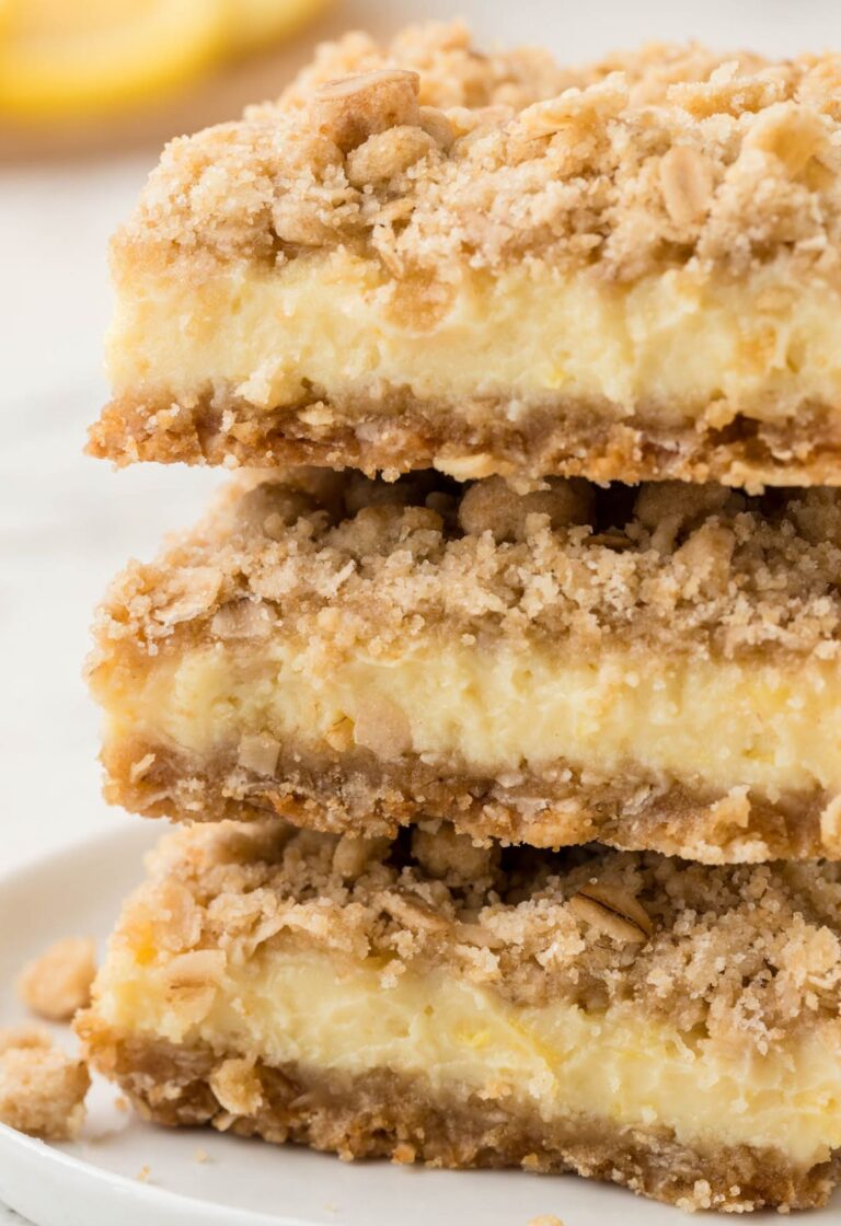 Stack of the lemon bars with crumble topping