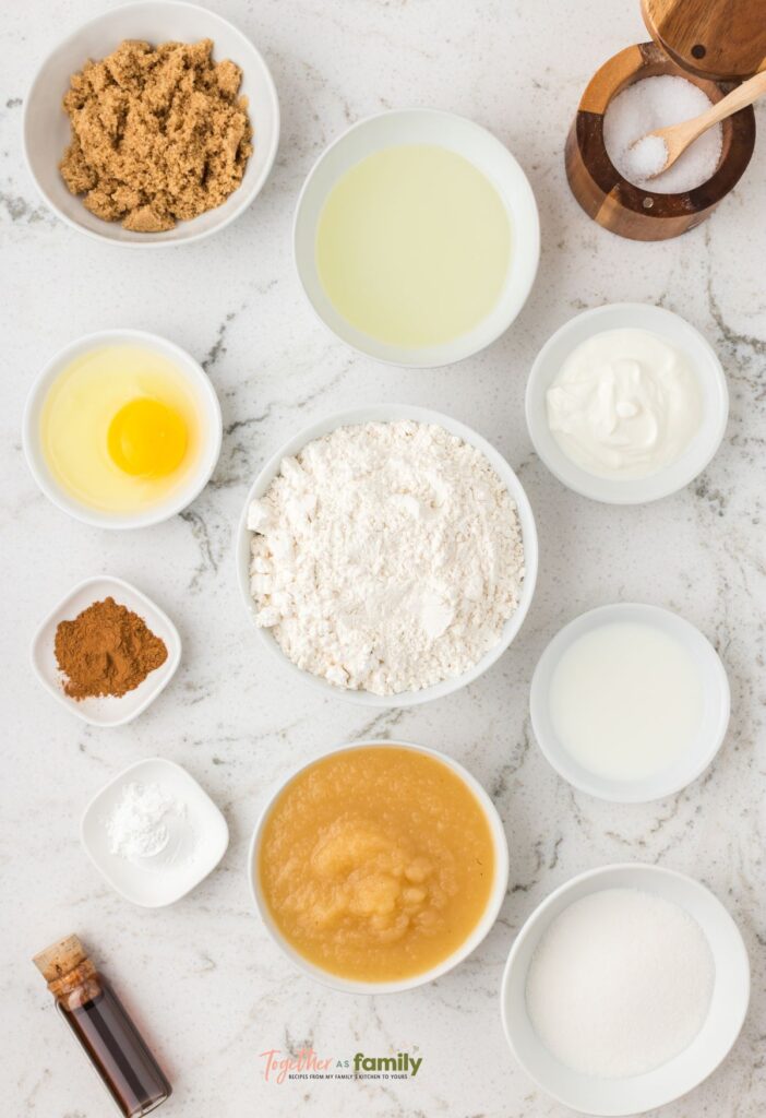 Ingredients laid out showing what you need to make one bowl applesauce muffins.