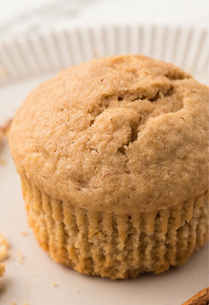 One single muffin on a white plate