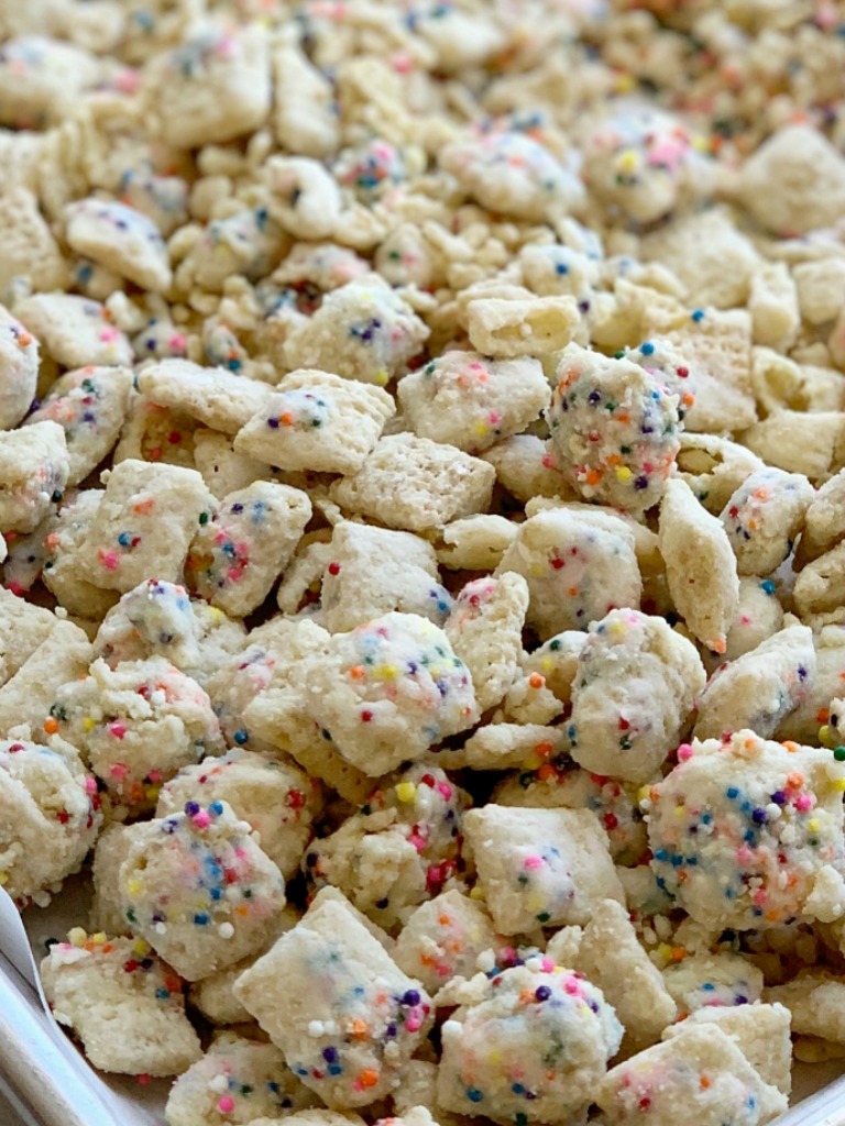 Chex Mix gets a funfetti makeover! Rice Chex cereal, white chocolate, rainbow sprinkles, and powdered sugar makes this Chex mix a crowd favorite! So easy to make and perfect for a party or fun treat to make with kids.