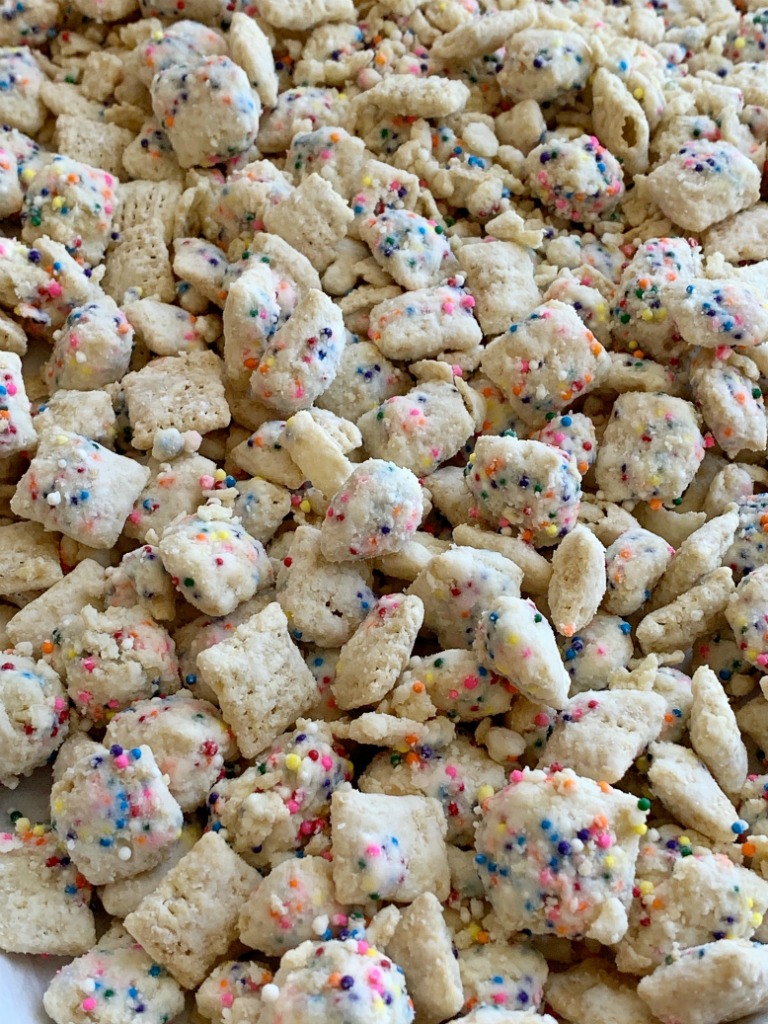 Funfetti Chex Mix | Muddy Buddys | Puppy Chow Recipe | Rice Chex cereal covered in white chocolate, rainbow sprinkles, and powdered sugar. So fun and easy to make with kids! The best sweet chex mix that tastes like funfetti sugar cookies! #chexmix #puppychow #recipeoftheday #funfetti #rainbowfood