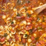 Minestrone soup is a healthy soup recipe with beans, pasta, vegetables that simmers in a tomato sauce vegetable broth base.