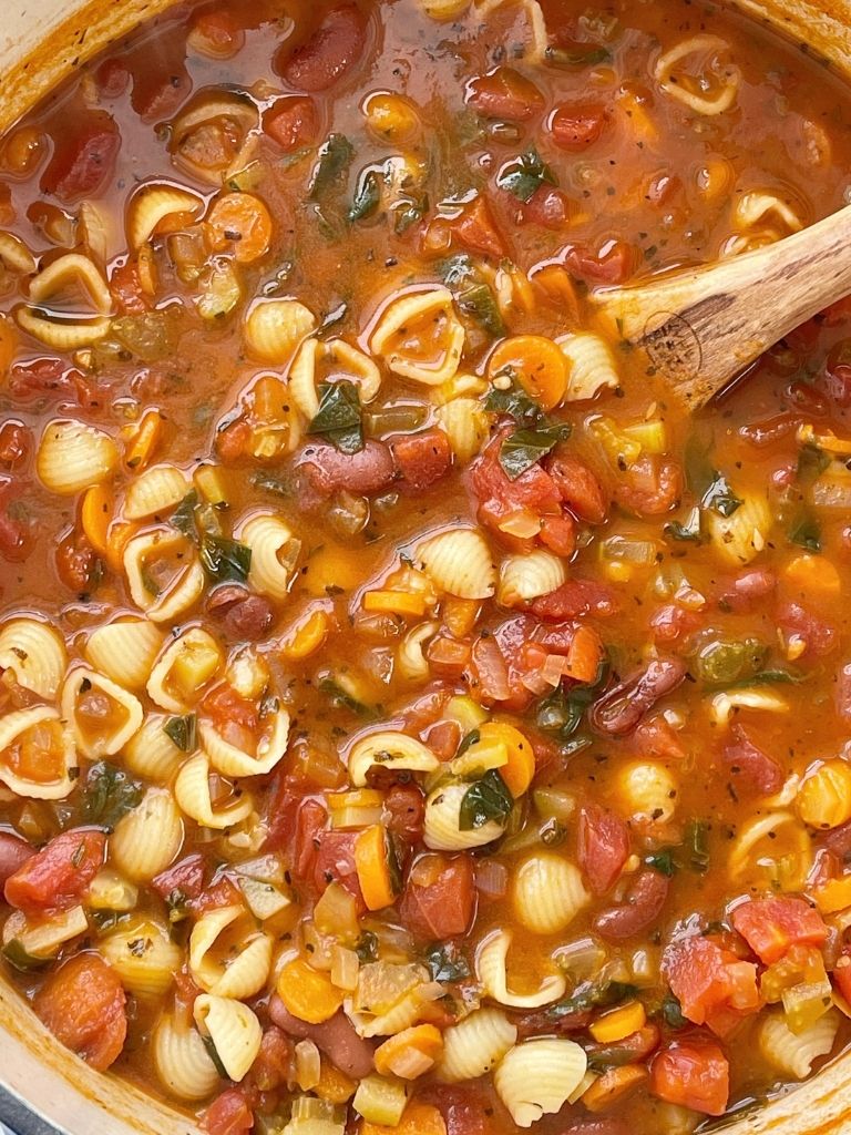 Minestrone soup is a healthy soup recipe with beans, pasta, vegetables that simmers in a tomato sauce vegetable broth base. 