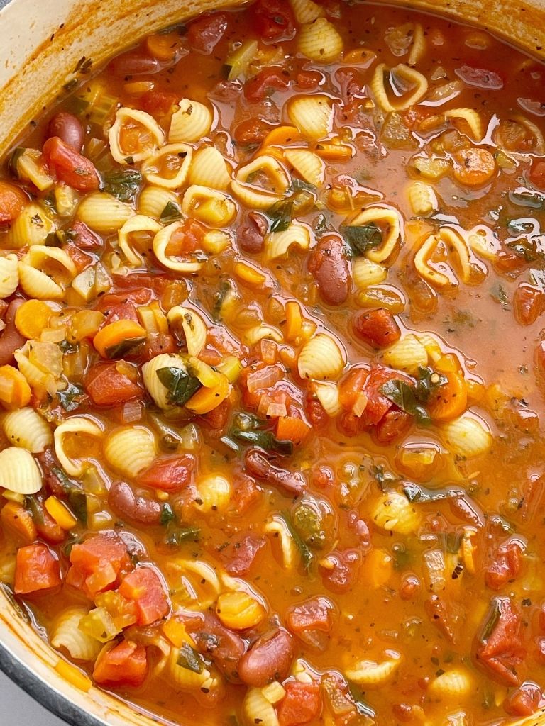 Minestrone soup recipe that cooks in one pot on the stove top with beans, vegetables, in a vegetable broth tomato sauce base. 