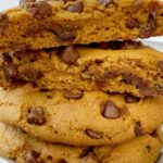 Pumpkin Chocolate Chip Cookies just like you find at a bakery! Big cookies that are soft-baked, loaded with milk chocolate chips, and all the warm pumpkin spices.