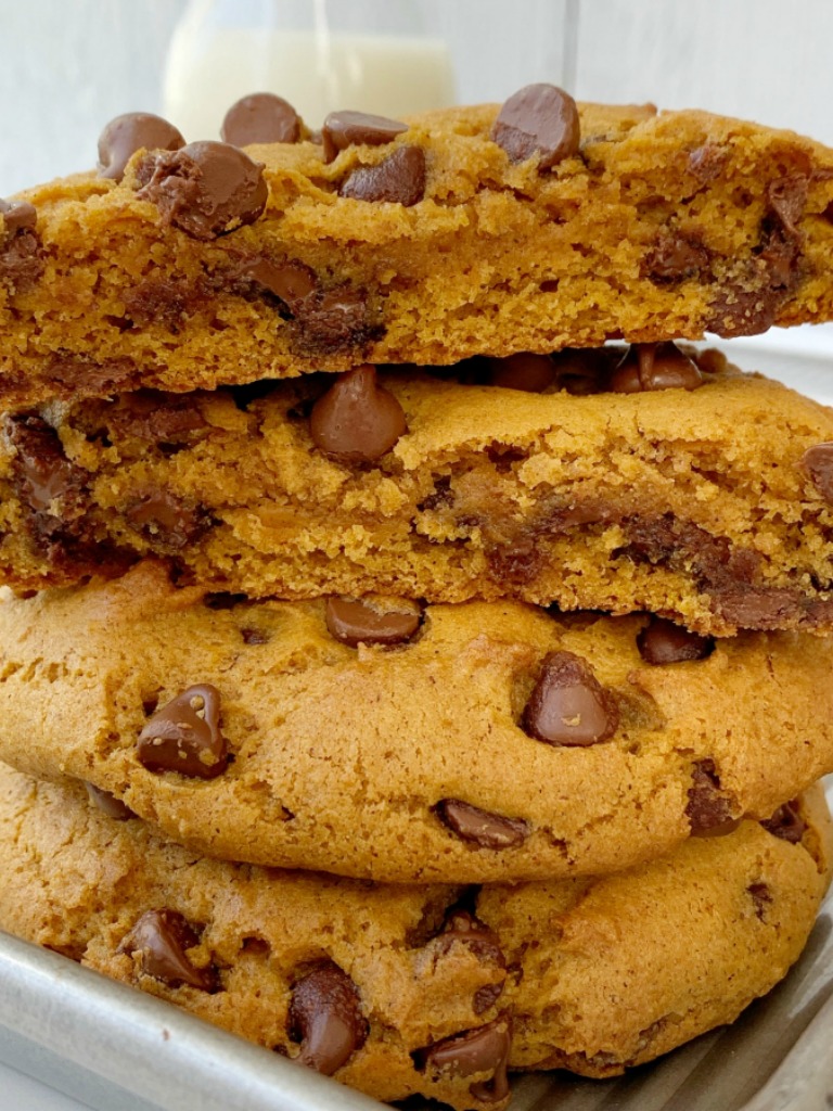 Pumpkin Chocolate Chip Cookies just like you find at a bakery! Big cookies that are soft-baked, loaded with milk chocolate chips, and all the warm pumpkin spices. 